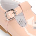 Little T-Strap shoes with perforated design in patent leather in pastel colors.