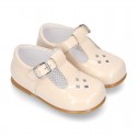 Little T-Strap shoes with perforated design in patent leather in pastel colors.