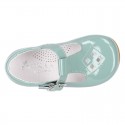 Little T-Strap shoes with perforated design in patent leather in pastel colors.