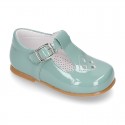 Little T-Strap shoes with perforated design in patent leather in pastel colors.