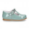 Little T-Strap shoes with perforated design in patent leather in pastel colors.