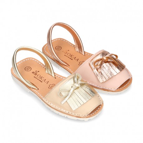Classic rear strap Menorquina shoes with fringed design in extra soft nappa leather and metal finish.