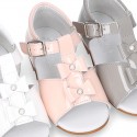 Patent leather Little T-Strap Sandal shoes with buckle fastening and with bows and pearls design.