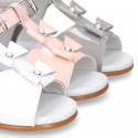 Patent leather Little T-Strap Sandal shoes with buckle fastening and with bows and pearls design.