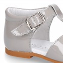 Patent leather Little T-Strap Sandal shoes with buckle fastening and with bows and pearls design.