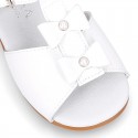 Patent leather Little T-Strap Sandal shoes with buckle fastening and with bows and pearls design.