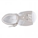 Patent leather Little T-Strap Sandal shoes with buckle fastening and with bows and pearls design.