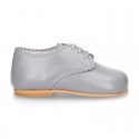 Classic little LACES UP style shoes in nappa leather with scallop.