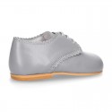 Classic little LACES UP style shoes in nappa leather with scallop.