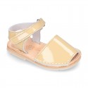 Patent leather Menorquina sandals with hook and loop strap.