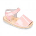 Patent leather Menorquina sandals with hook and loop strap.