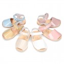 Patent leather Menorquina sandals with hook and loop strap.