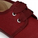 New little laces up shoes in cotton canvas to dress.