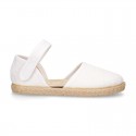 White canvas espadrille shoes with LACES design and velcro strap closure.