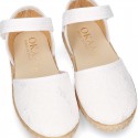 White canvas espadrille shoes with LACES design and velcro strap closure.