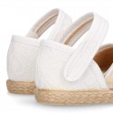 White canvas espadrille shoes with LACES design and velcro strap closure.