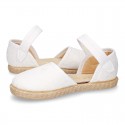 White canvas espadrille shoes with LACES design and velcro strap closure.