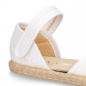 White canvas espadrille shoes with LACES design and velcro strap closure.