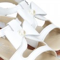 WHITE Nappa Leather Sandal shoes with central big bow and pearls design for girls.
