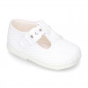 Cotton canvas T-Strap shoes with blue polka dots design.