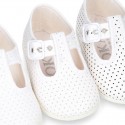 Cotton canvas T-Strap shoes with blue polka dots design.