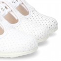 Cotton canvas T-Strap shoes with blue polka dots design.