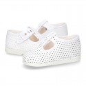 Cotton canvas T-Strap shoes with blue polka dots design.