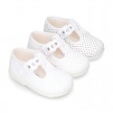 Cotton canvas T-Strap shoes with blue polka dots design.