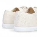 Canvas sneakers with metal finish and toe cap with VELCRO strap closure.