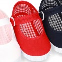 Cotton Canvas Little Mary Jane shoes with buckle fastening and clip and sneaker type sole.