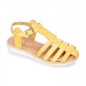 Cowhide leather sandal shoes caged type design with white soles.