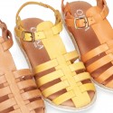 Cowhide leather sandal shoes caged type design with white soles.