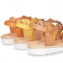 Cowhide leather sandal shoes caged type design with white soles.