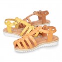 Cowhide leather sandal shoes caged type design with white soles.