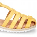 Cowhide leather sandal shoes caged type design with white soles.