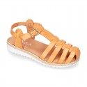 Cowhide leather sandal shoes caged type design with white soles.