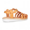 Cowhide leather sandal shoes caged type design with white soles.