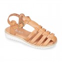 Cowhide leather sandal shoes caged type design with white soles.