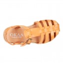 Cowhide leather sandal shoes caged type design with white soles.