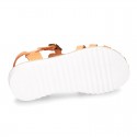 Cowhide leather sandal shoes caged type design with white soles.