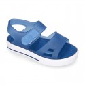 Jelly shoes sandal style with velcro strap and tenis sole design.