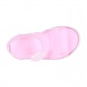 Jelly shoes sandal style with velcro strap and tenis sole design.