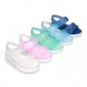 Jelly shoes sandal style with velcro strap and tenis sole design.