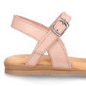 Leather sandal shoes to dress with two rear straps and chopped design for girls.