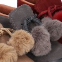 Booties with shoelaces closure with POMPONS in suede leather for kids.