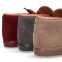 Booties with shoelaces closure with POMPONS in suede leather for kids.