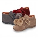Booties with shoelaces closure with POMPONS in suede leather for kids.
