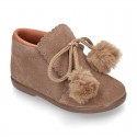 Booties with shoelaces closure with POMPONS in suede leather for kids.