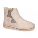 New suede leather ankle boots with WAVES elastic band and zipper closure.