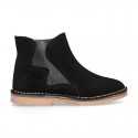 New suede leather ankle boots with WAVES elastic band and zipper closure.